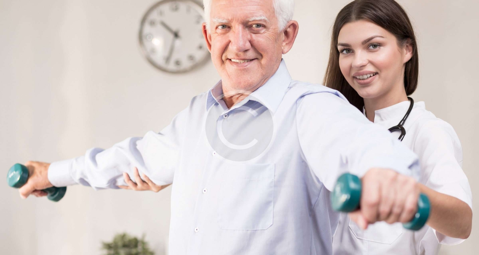 Doctor helping elderly man excerise